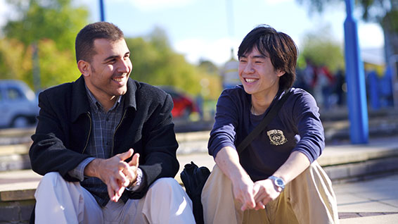 Students sitting on steps at Edinburgh Campus