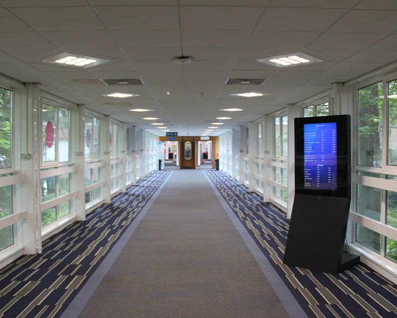 The Bridge Link connects the James Watt Centre to the Hugh Nisbet Building Long carpeted walkway with windows along both sides