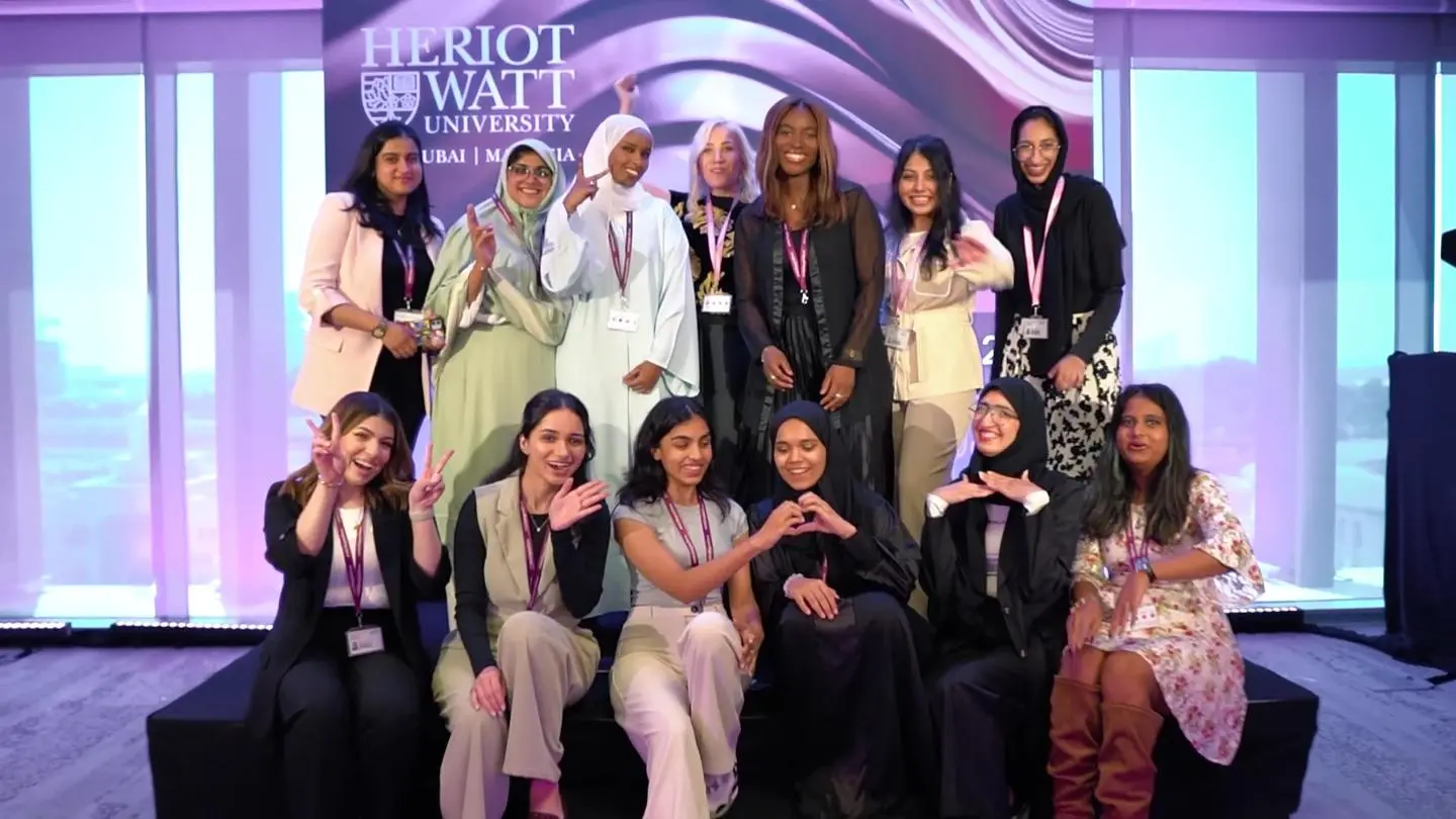 group of female students posing on The Degree Showcase stage