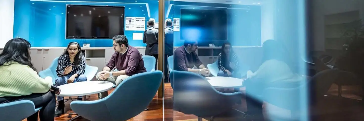 Students in a breakout area of the Edinburgh Business School