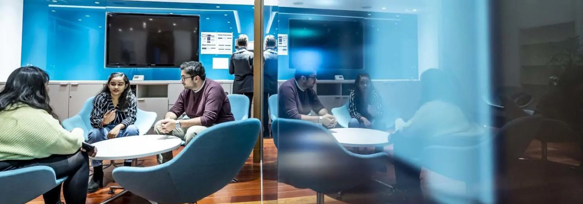 Students in a breakout area of the Edinburgh Business School