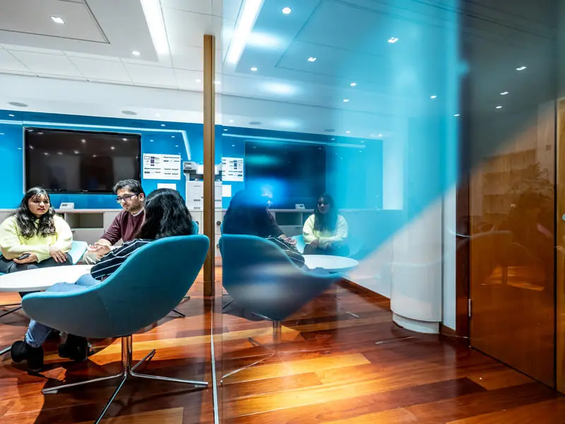 Students take a break in the Edinburgh Business School break out area seating