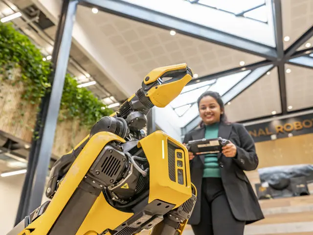 A student working with a robot