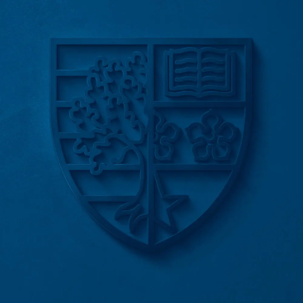 Blue Heriot-Watt University logo shield on a blue background 