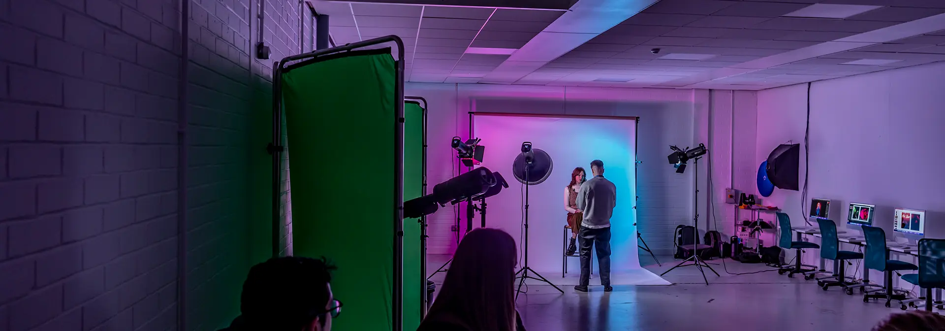 A photography studio with several students