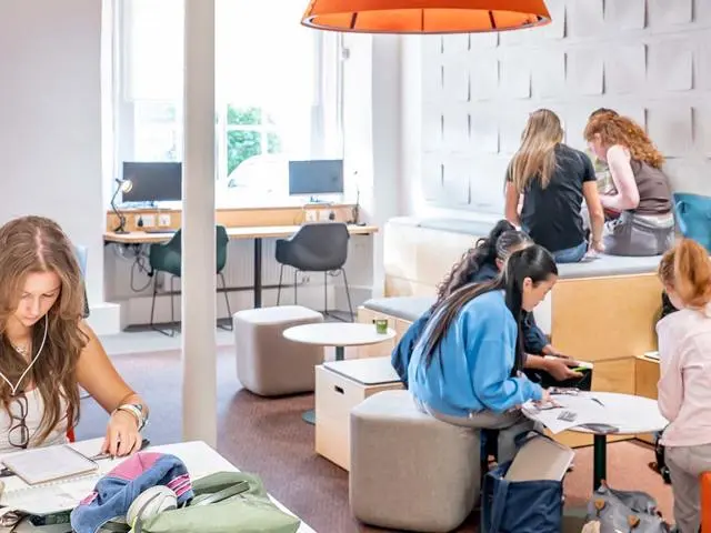 Students working in the Student Commons at the Borders Campus