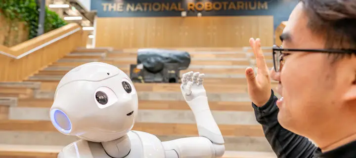 robot giving a human a high-five
