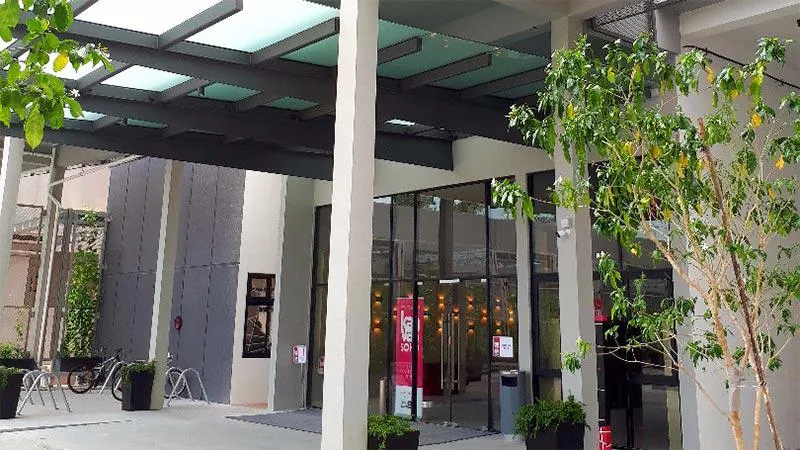Entrance to lobby Entrance to lobby, with pillars and trees