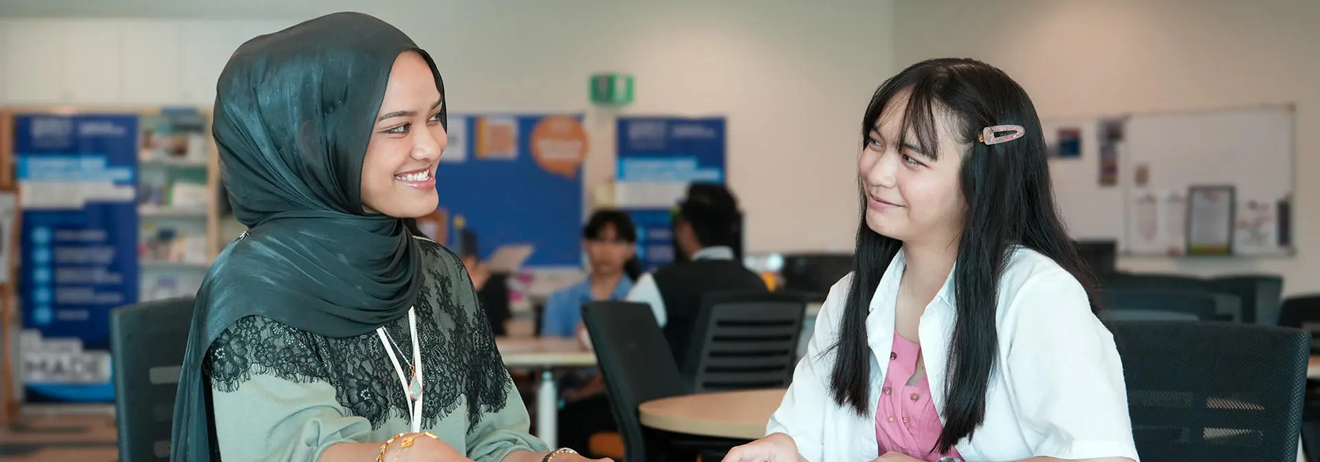 Two students in the Heriot-Watt Malaysia campus in discussion