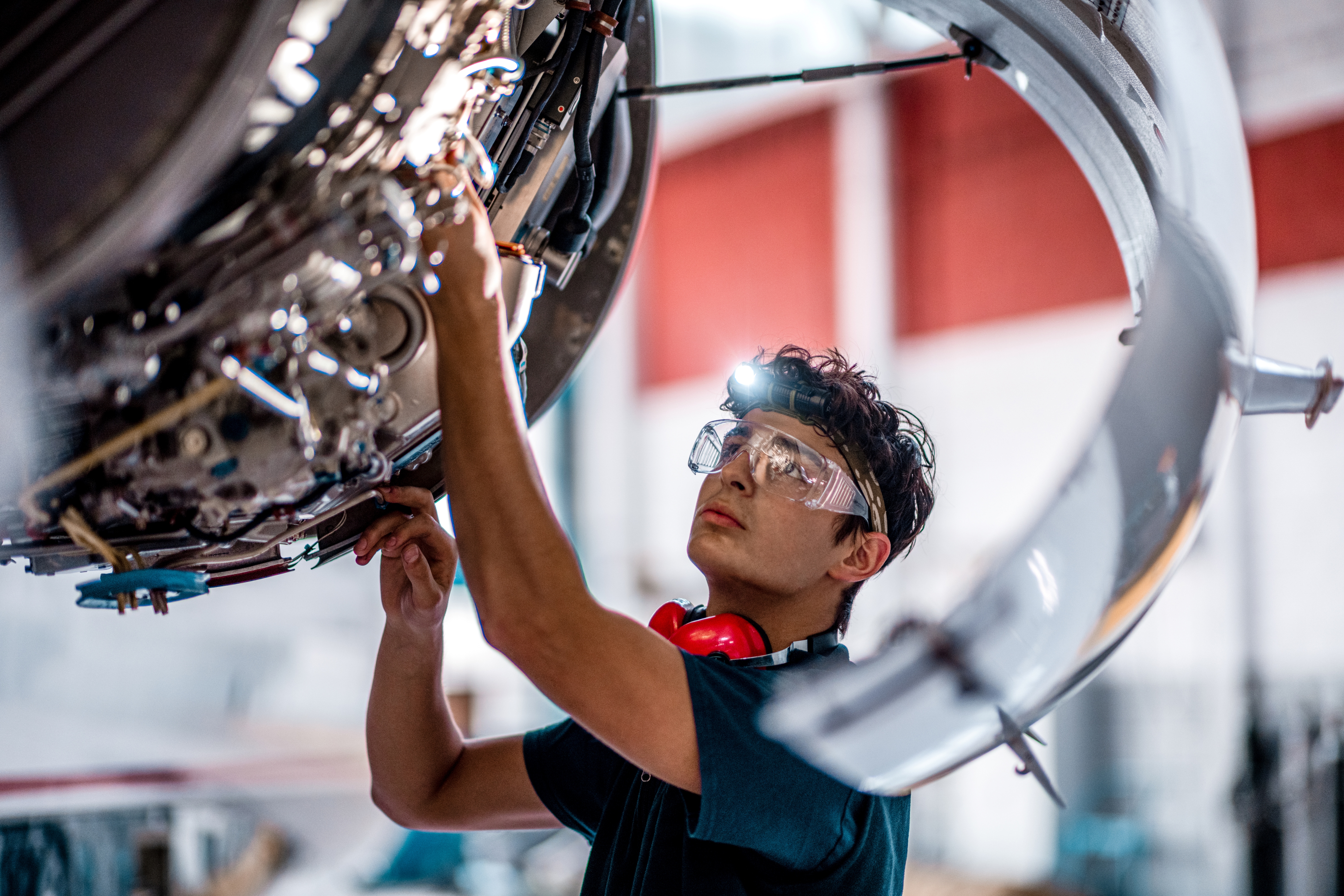 Apprentice working on an aircraft engine