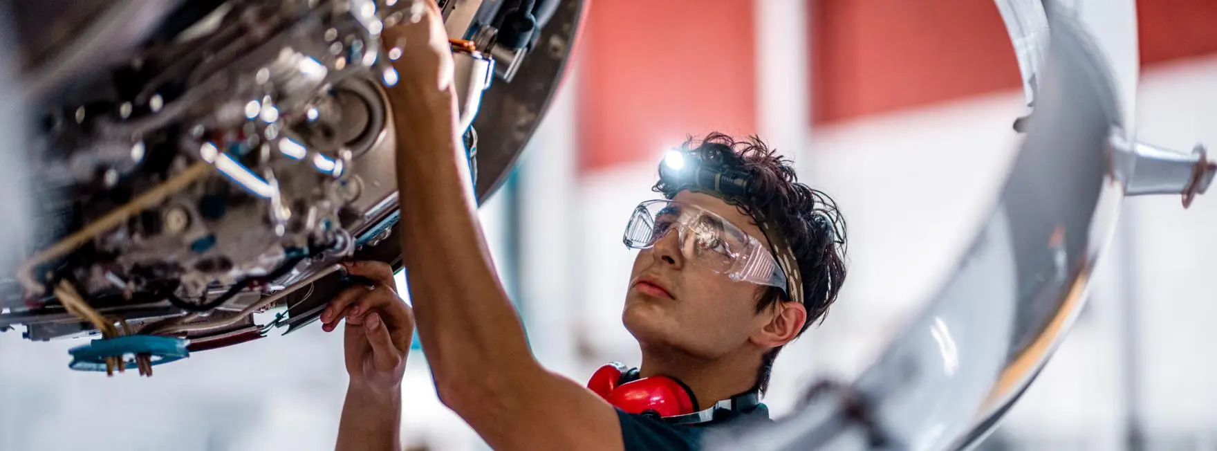 Apprentice working on an aircraft engine
