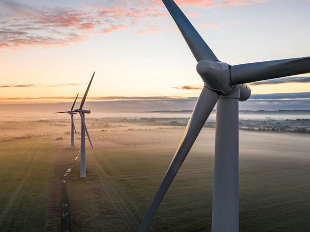 Three wind farm structures at sea