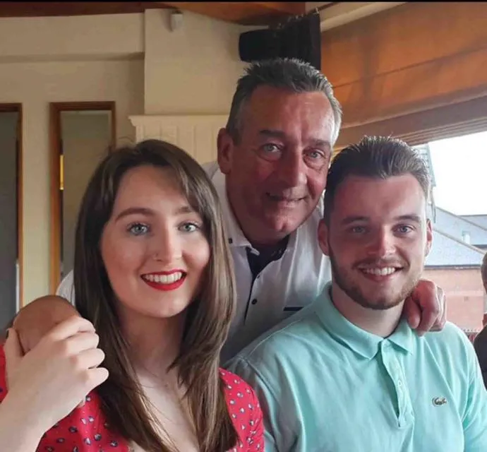Image shows Caitlin Cummings pictured with her father John and brother Scott. 