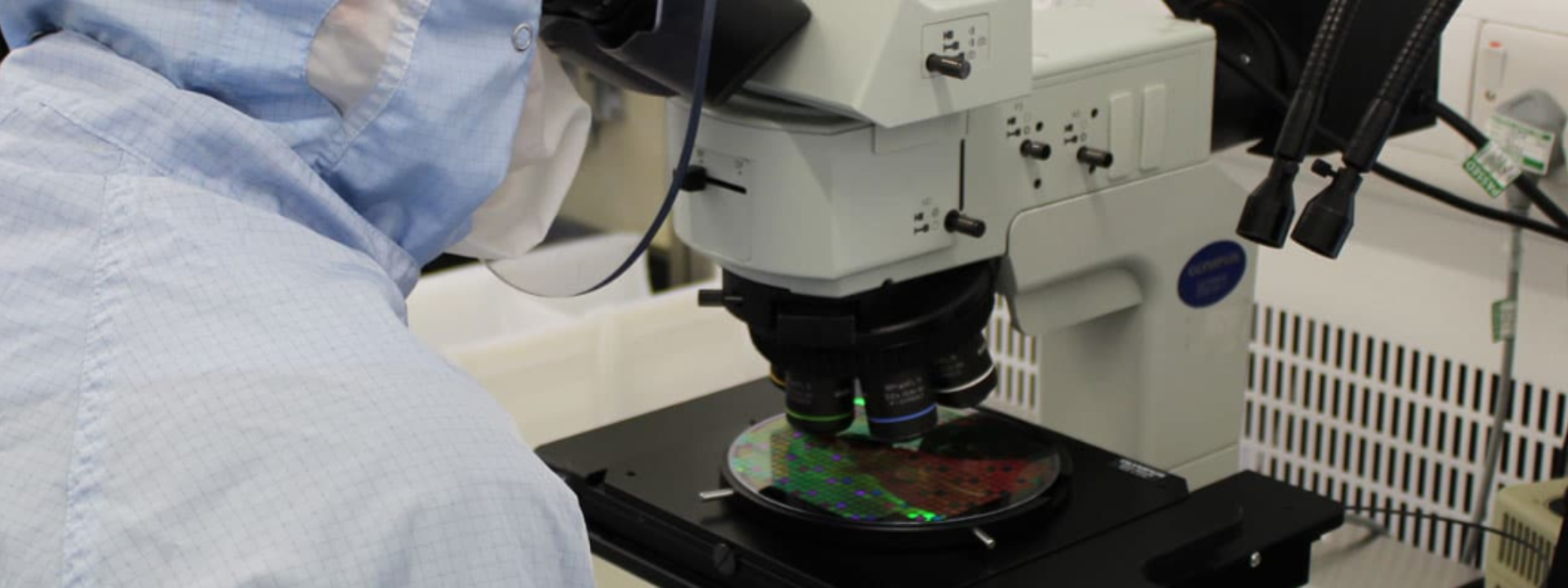 Semiconductor manufacturer working on a Silicon Carbide semiconductor wafer