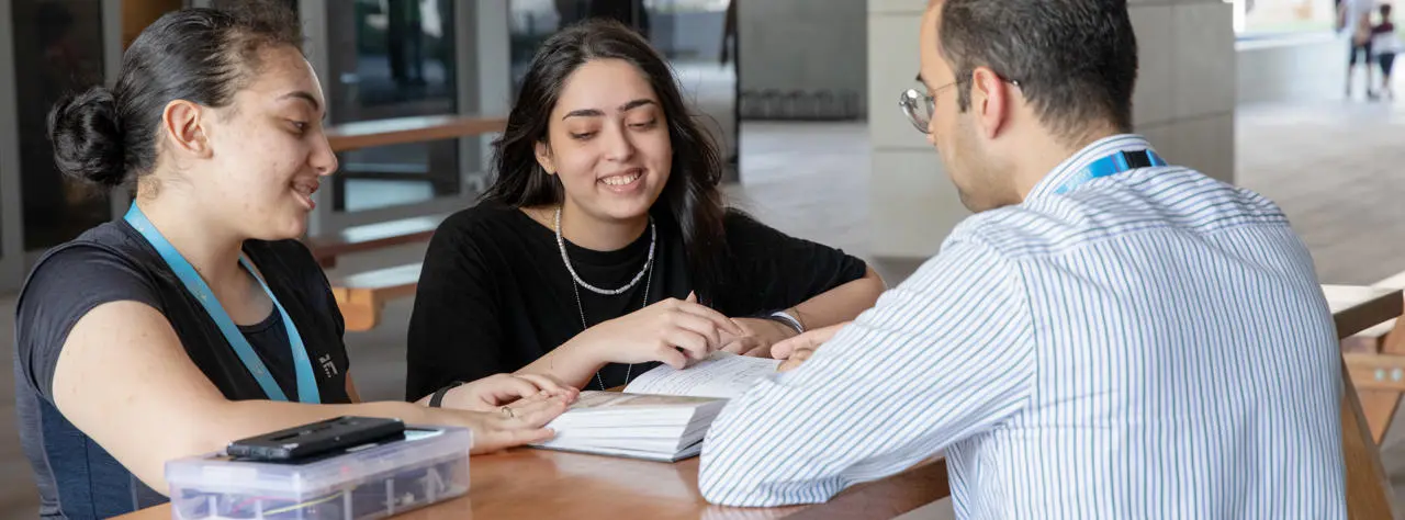 professor talking to students