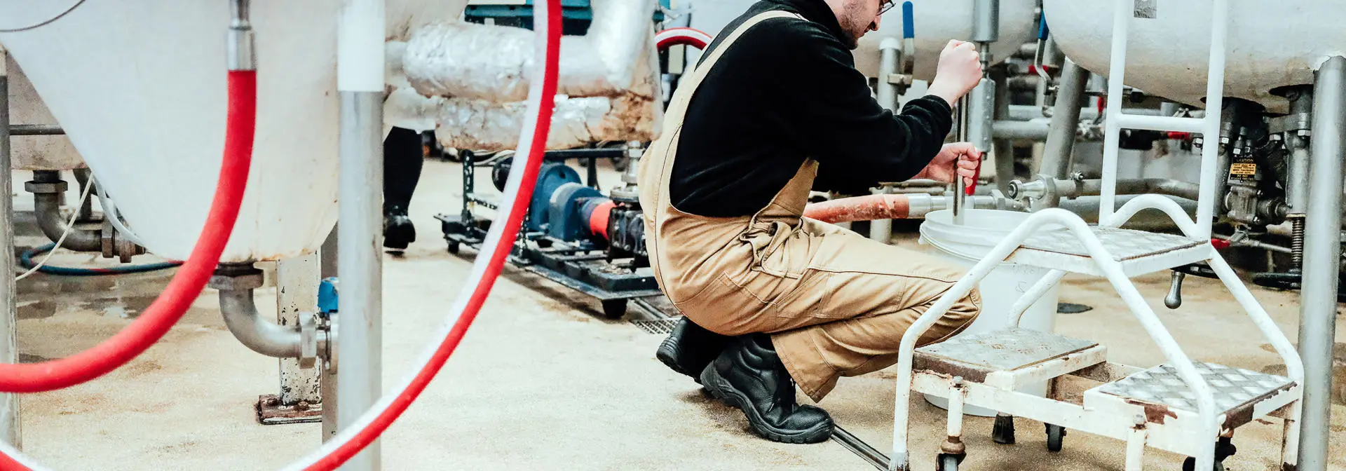 Student checking on the fermentation process in the microbrewery