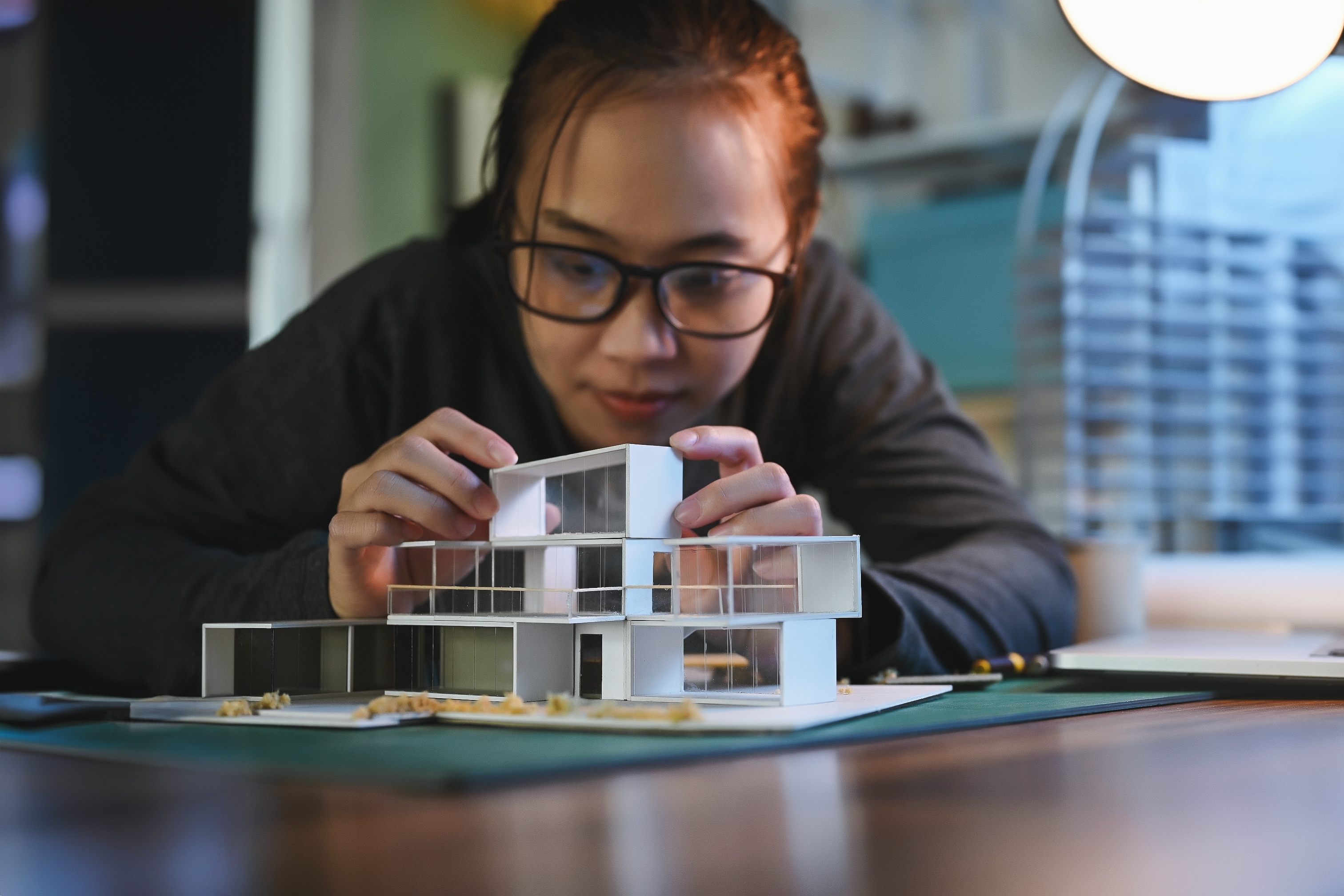 student working on architecture model