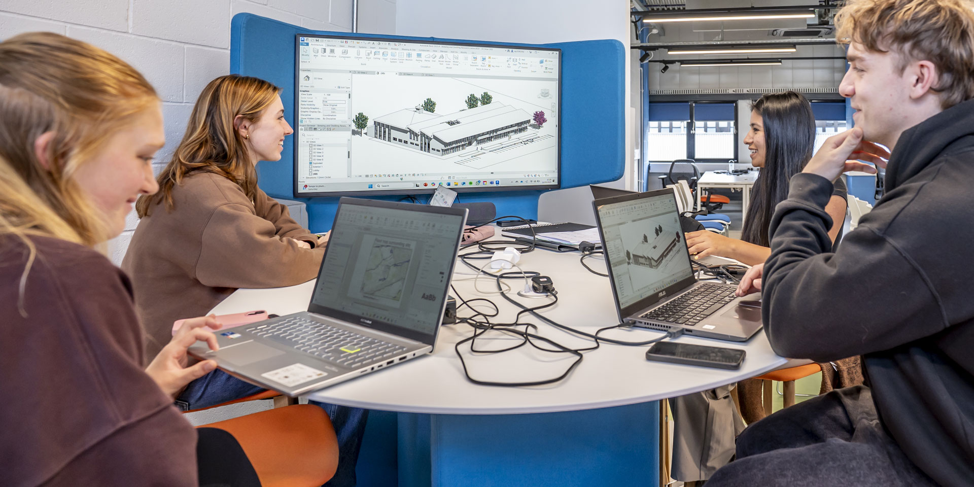 Students collaborate on a design project in the studio.