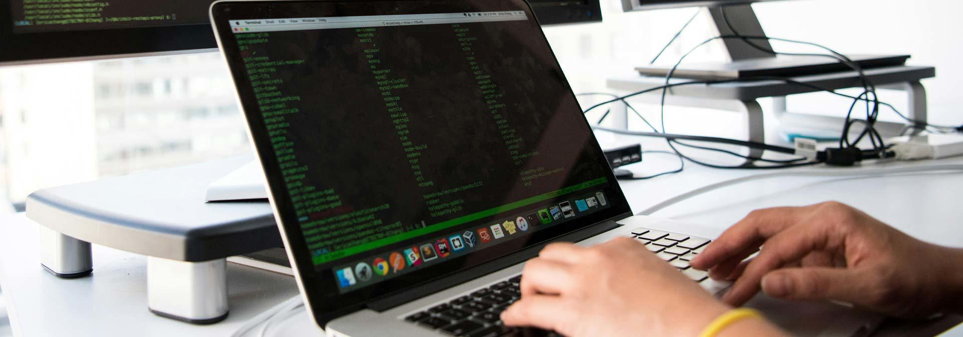 A developer working on a laptop