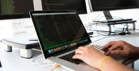 A developer working on a laptop