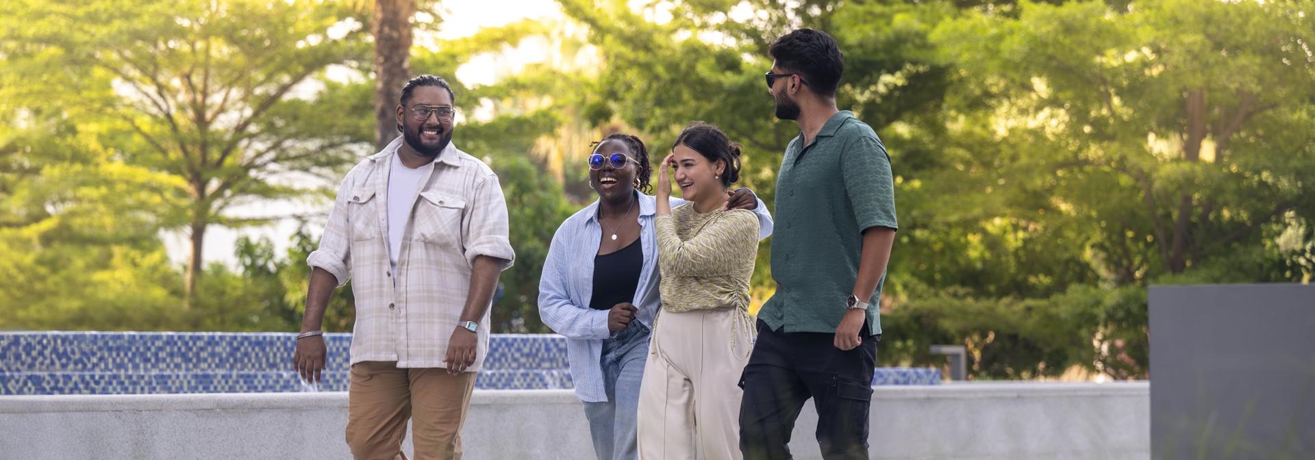 Students in Dubai walking outside on campus