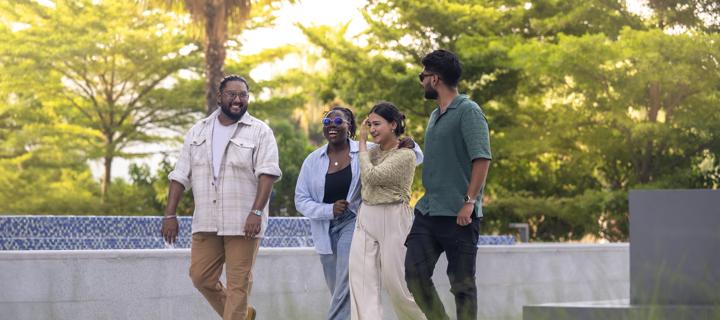 Students in Dubai walking outside on campus