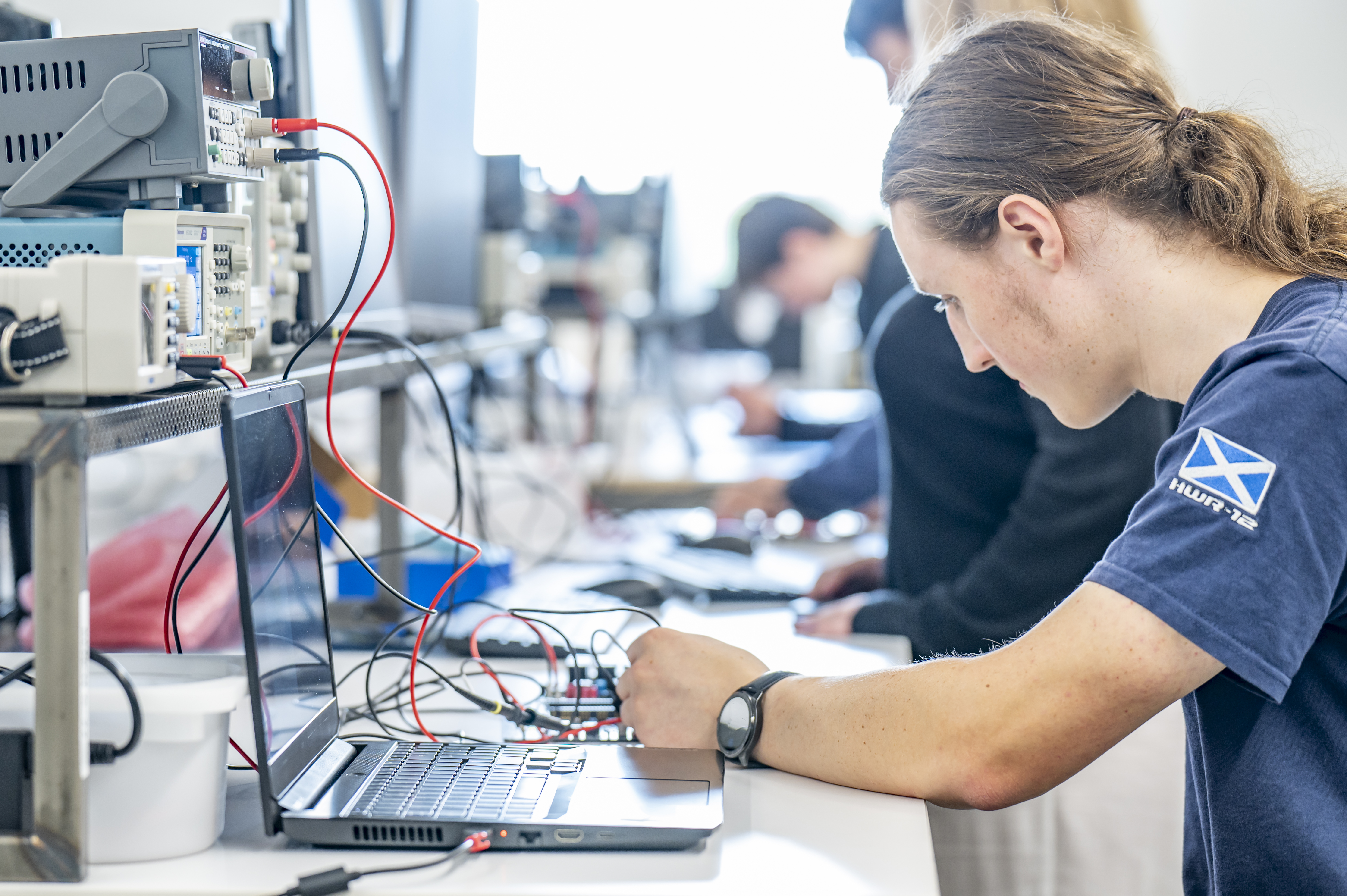 Student working on digital equipment