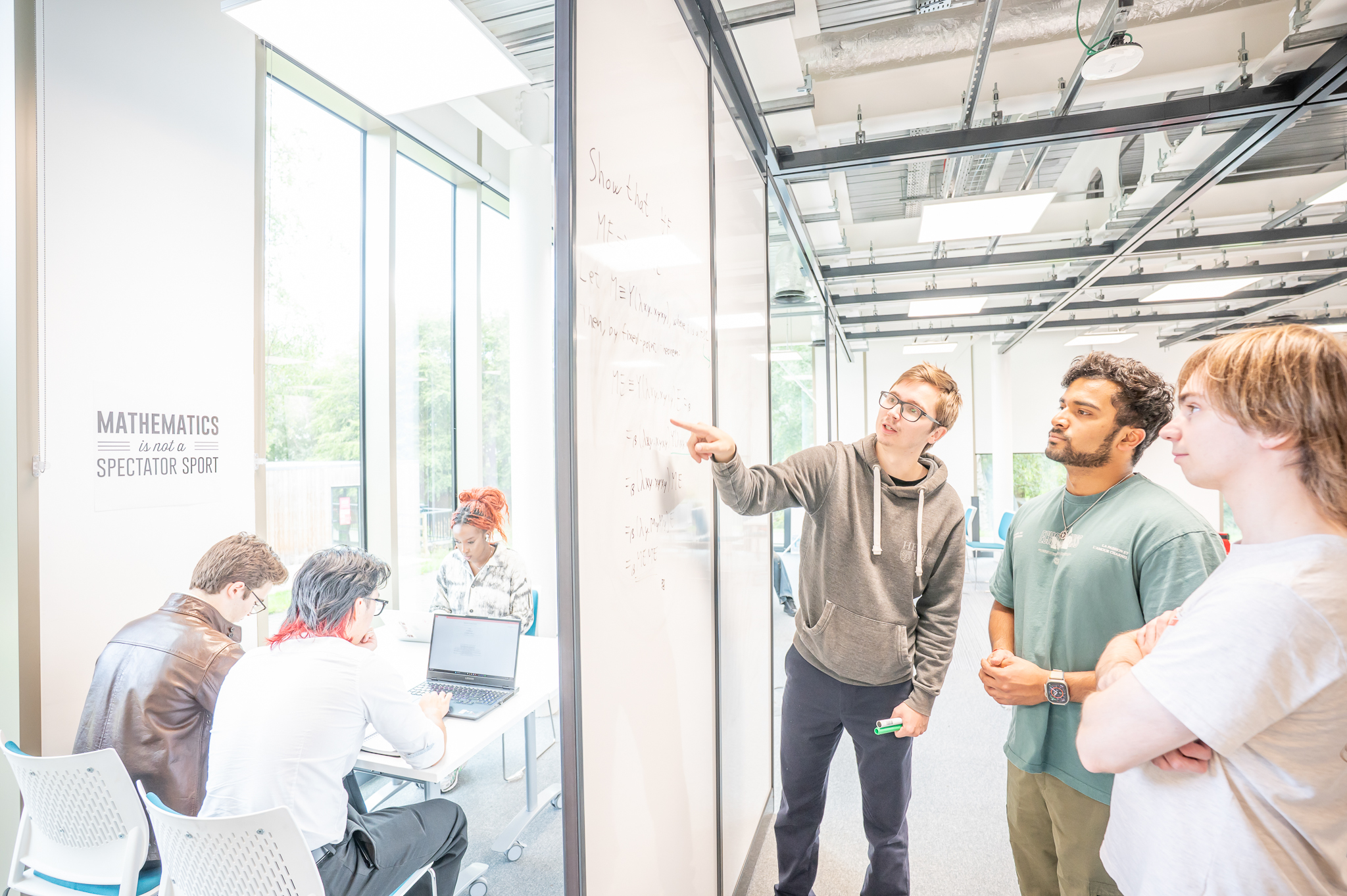 Students working on a problem together in a maths gym