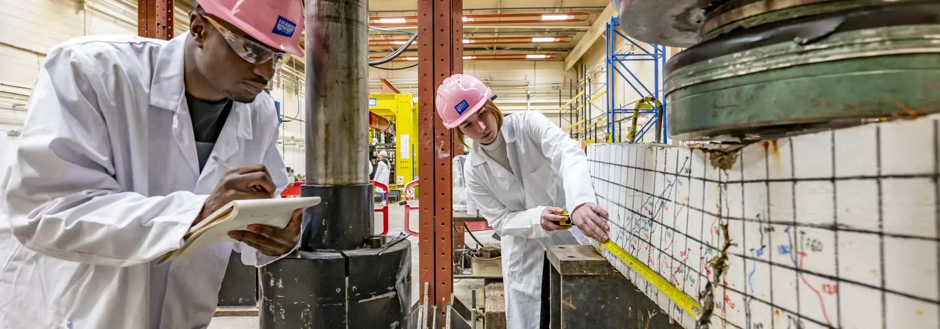 Civil Engineer Students in a Workshop Measuring Faults