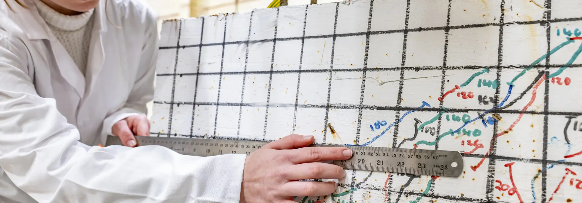 Student measuring structural movement under pressure