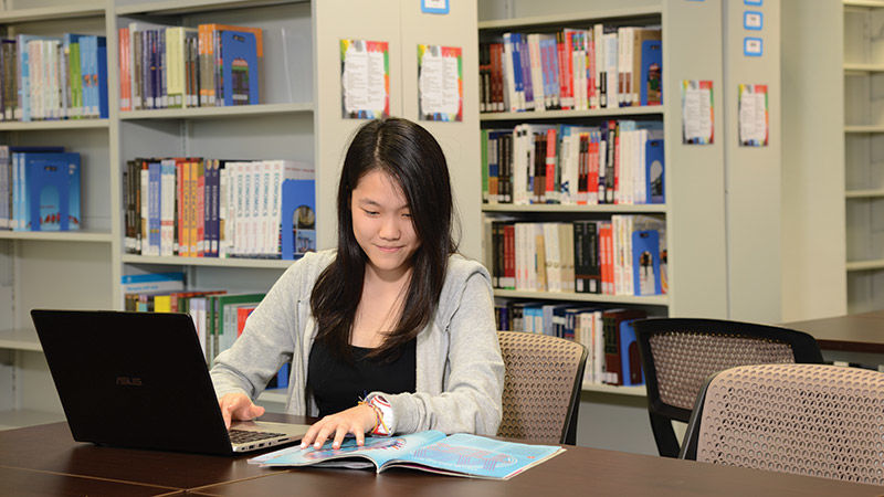 The two-storey library has been planned to cater for the different learning styles and preferences of students. Student studying in Malaysia Campus library