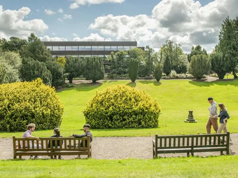 Students chat as the walk through the campus grounds.