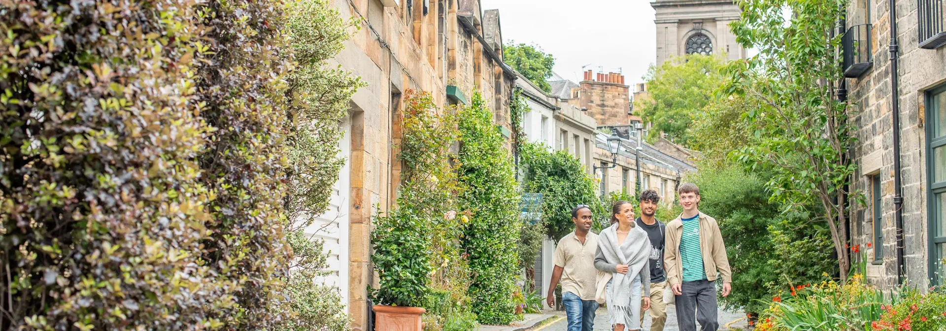 Four students walking down Circus Lane in Edinburgh