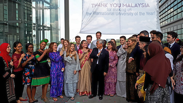 group shot of students celebrating winning International University of The Year